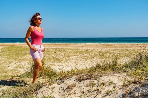 Woman walking on beach, Spain — Stock Photo, Image