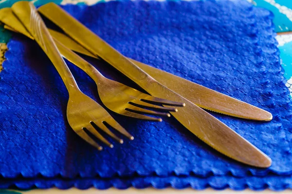 Two knifes and forks on handkerchief — Stock Photo, Image