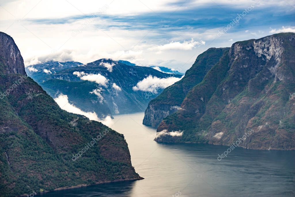 Aurlandsfjord fjord landscape with clouds over sea surface. Norway Scandinavia. National tourist route Aurlandsfjellet.