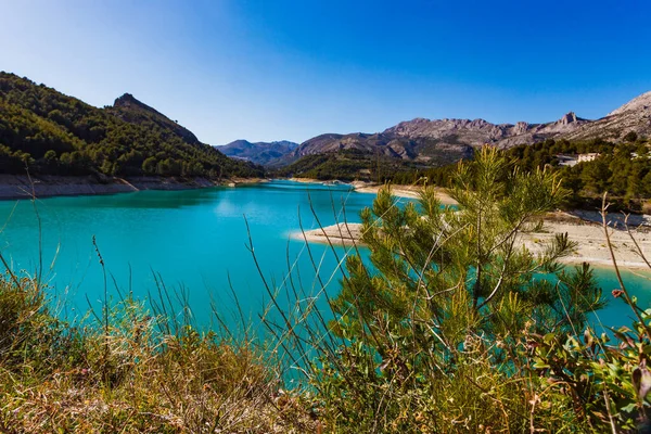 View on Guadalest water reservoir with turquoise water in Alicante province Spain
