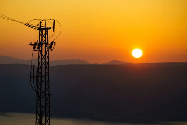 Coast Electricity Transmission Pylons Power Lines High Voltage Towers Sunset — Stock Photo, Image