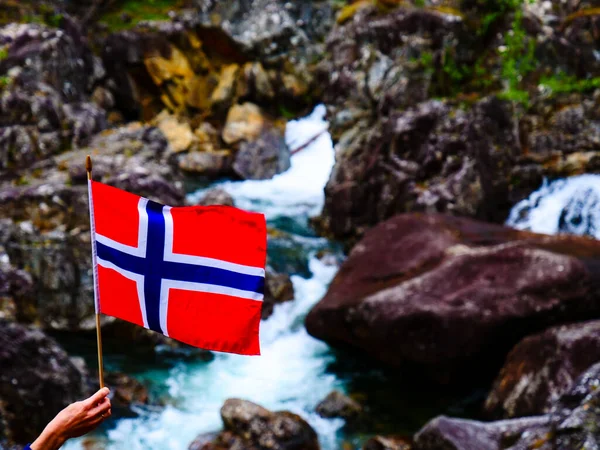 Tourist Hand Holding Norwegian Flag Outdoor Rocks Mountain Nature — Stock Photo, Image