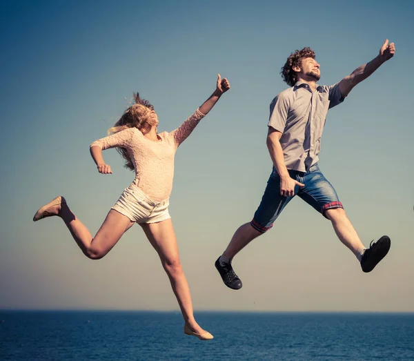 Carefree Young Couple Friends Jumping Sea Ocean Water Happy Woman — Stock Photo, Image