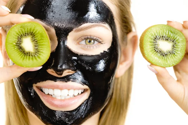 Young Woman Carbo Black Peel Mask Her Face Holding Kiwi — Stock Photo, Image