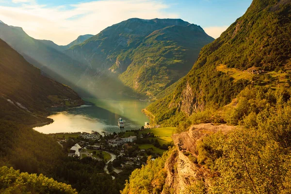 Fjord Geirangerfjord with cruise ship at sunset, view from Flydalsjuvet viewing point, Norway. Travel destination