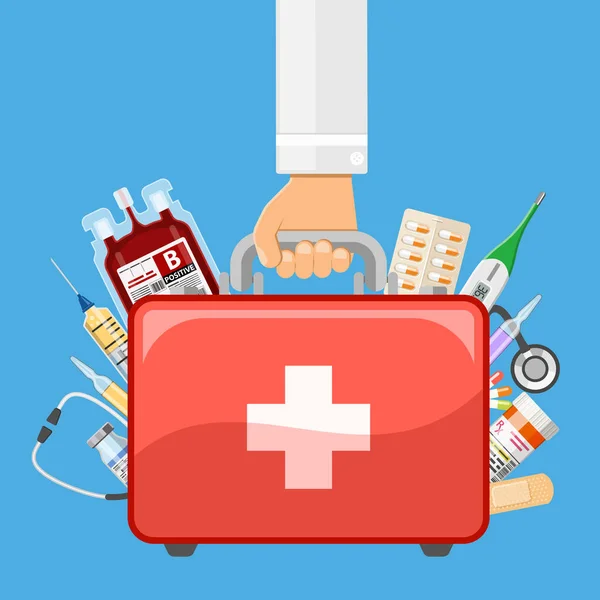 Kit de primeros auxilios en la mano del médico — Vector de stock