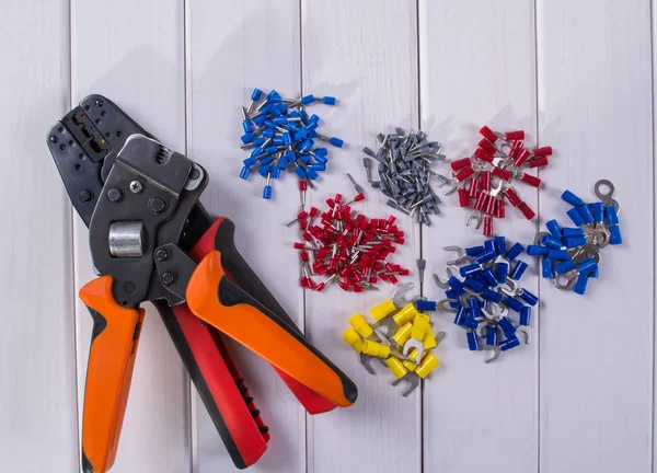 Cable lug in different colors and sizes, Tools for crimping. — Stock Photo, Image