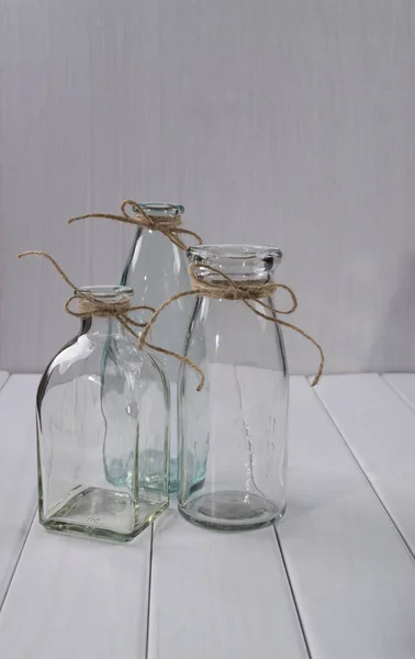 Tres botellas vacías de vidrio — Foto de Stock