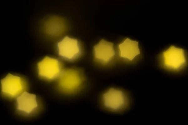 Verschwommenes gelbes Licht Bokeh abstrakten Hintergrund — Stockfoto
