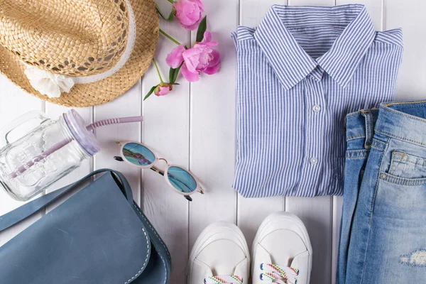 flat lay  woman summer clothes and accessories collage   with shirt, jeans, glasses, shoes, handbag, hat, Jar