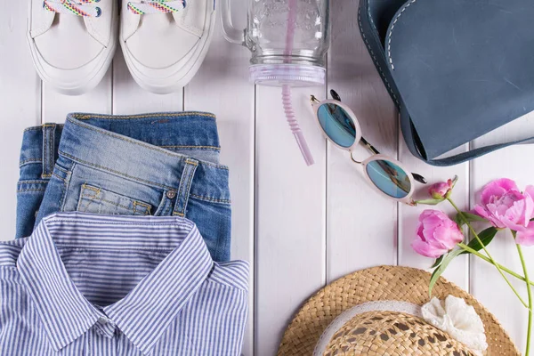flat lay  woman summer clothes and accessories collage   with shirt, jeans, glasses, shoes, handbag, hat, Jar