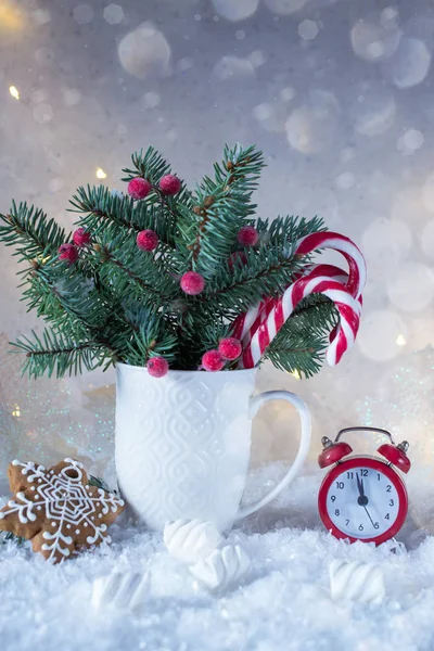 Christmas fir tree with decoration candy canes and red clock. — Stock Photo, Image