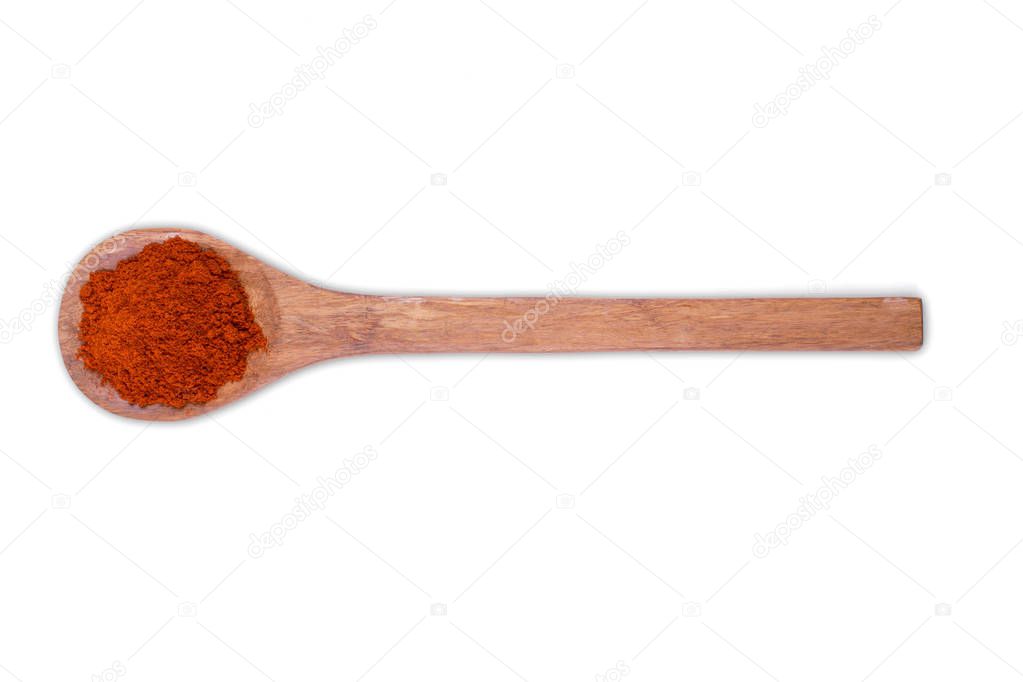 Paprika powder on wooden spoon isolated on white background 