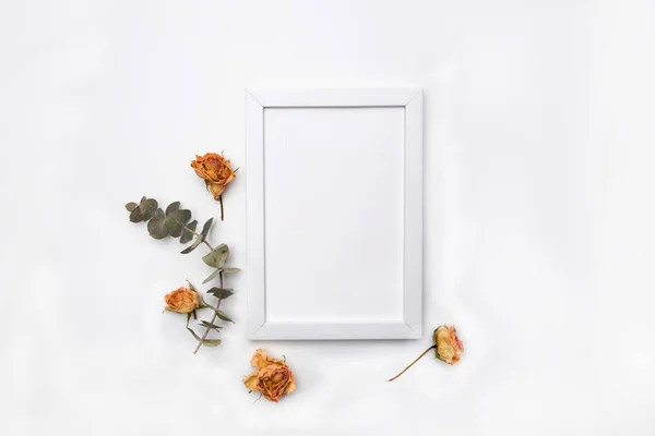 Dried flowers composition. Frame made of dried rose. Flat lay, top view Autumn floral pattern