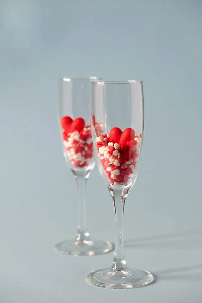 Two Champagne Glasses Red Heart Shaped Sugar Candy Blue Background — 스톡 사진