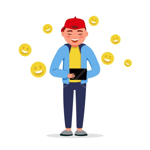 Niño feliz con una tableta que tiene chat con emojis sonrisa aislados sobre fondo blanco. Chico sonriente divertido en diseño plano . — Vector de stock