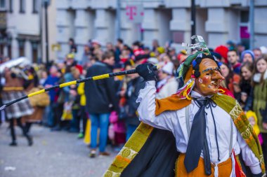 ROTTWEIL , GERMANY - FEB 24 : Participants in the Rottweil Carnival in Rottweil , Germany on February 24 2020.  The carnival known as Fasnacht is a custom in southwest Germany 