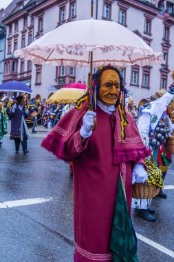 ROTTWEIL , GERMANY - FEB 24 : Participants in the Rottweil Carnival in Rottweil , Germany on February 24 2020.  The carnival known as Fasnacht is a custom in southwest Germany 