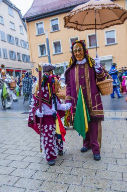 ROTTWEIL , GERMANY - FEB 24 : Participants in the Rottweil Carnival in Rottweil , Germany on February 24 2020.  The carnival known as Fasnacht is a custom in southwest Germany 
