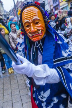 ROTTWEIL , GERMANY - FEB 24 : Participants in the Rottweil Carnival in Rottweil , Germany on February 24 2020.  The carnival known as Fasnacht is a custom in southwest Germany 