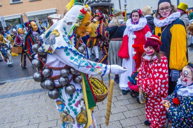 ROTTWEIL , GERMANY - FEB 24 : Participants in the Rottweil Carnival in Rottweil , Germany on February 24 2020.  The carnival known as Fasnacht is a custom in southwest Germany 