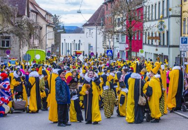ROTTWEIL , GERMANY - FEB 24 : Participants in the Rottweil Carnival in Rottweil , Germany on February 24 2020.  The carnival known as Fasnacht is a custom in southwest Germany 