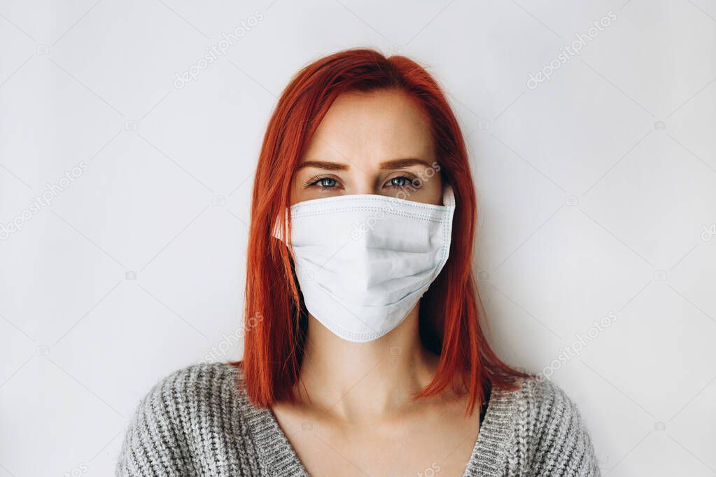 Girl in a medical mask in quarantine