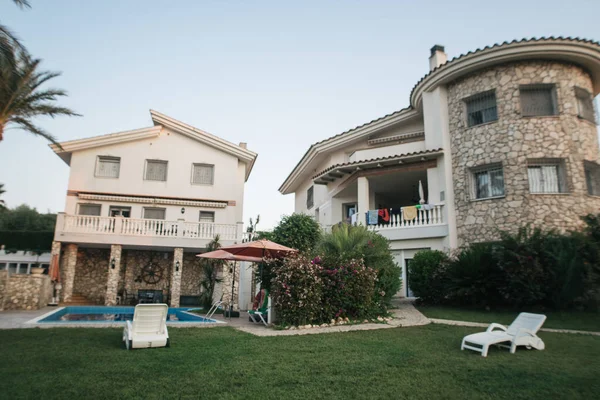 stock image villa with pool and palm trees in warm Spain