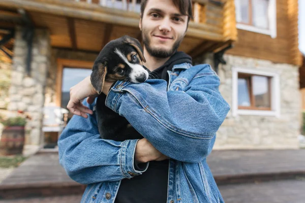 Young Man Holding Cute Doggy — Stock Photo, Image