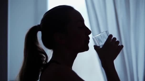Silhouette Young Woman Drinks Glass Water — Stock Video