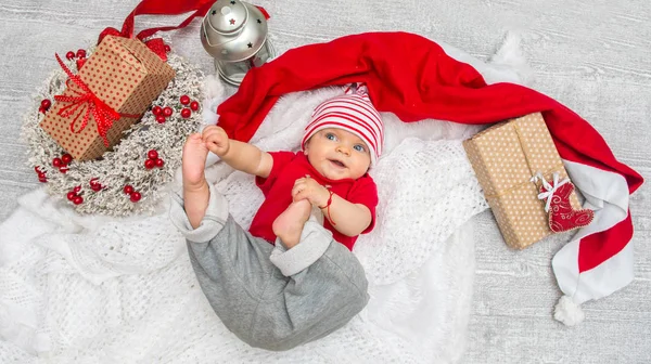 Christmas baby girl six months on the eve of Christmas Stock Picture