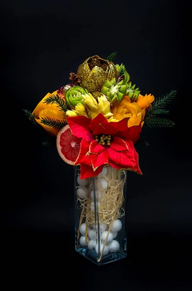 Composition bouquet of fruits in a vase on a black background. — Stock Photo, Image