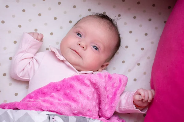 Portrait Newborn Baby Girl Lying Crib Laughing Merrily Pink Gray — Stock Photo, Image