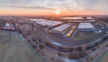 The Amazon distribution centre with it's connection to DHL and HAVI enjoying the sunrise, aerial clipart