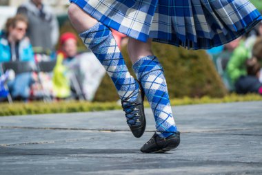 Highland dancer at highland games in scotland clipart