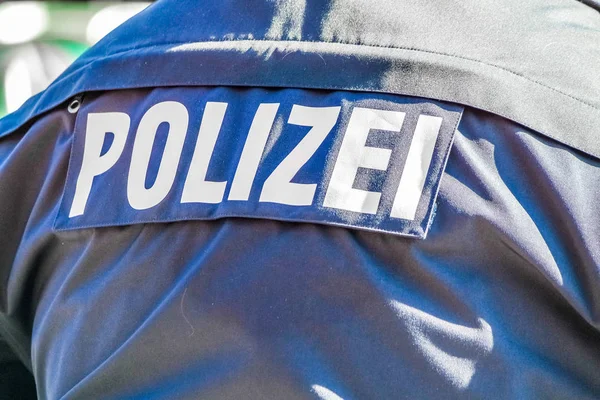 Duitse politie man met de blauwe jas — Stockfoto