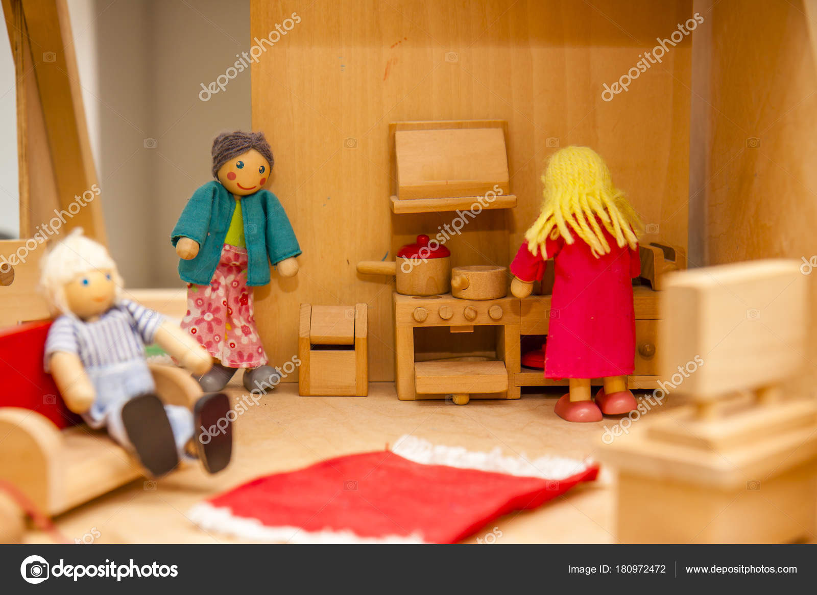 Closeup of wooden dollhouse family Stock Photo by ©Lukassek 180972472