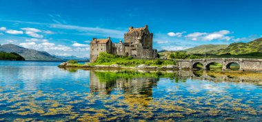 Eilean Donan Castle during a warm summer day - Dornie, Scotland clipart