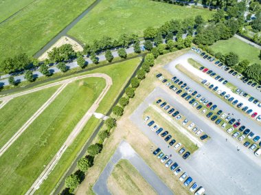 Aerial of a huge parking lot in the green clipart