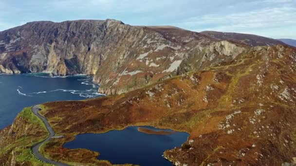 Aerial of Slieve League Cliffs are among the highest sea cliffs in Europe rising 1972 feet or 601 meters above the Atlantic Ocean - County Donegal, Ireland — Stock video
