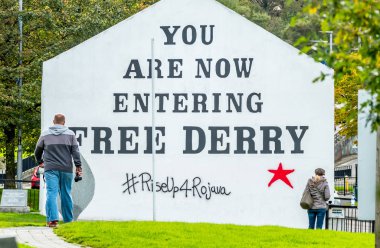 Derry , Northern Ireland - October 12 2019 : Man entering free Derry clipart