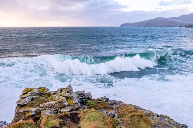 Huge waves breaking at Muckross Head - A small peninsula west of Killybegs, County Donegal, Ireland. The cliff rocks are famous for climbing
