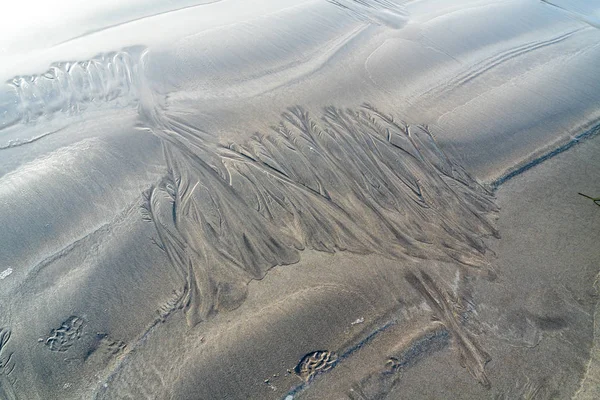 Sand surface with irregural wind pattern after storm — Stock Photo, Image