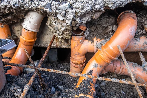 Broken pipes due to subsidence in the soil around the house