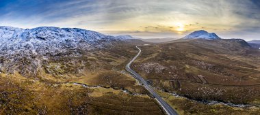 Aerial of the R251 Highway close to Mount Errigal, the highest mountain in Donegal - Ireland clipart