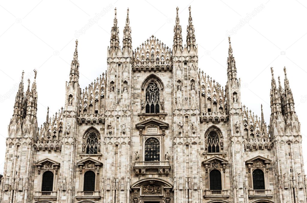 Famous Milan Cathedral is the fifth largest cathedral in the world. Detail of the front isolated on white Milan, Italy