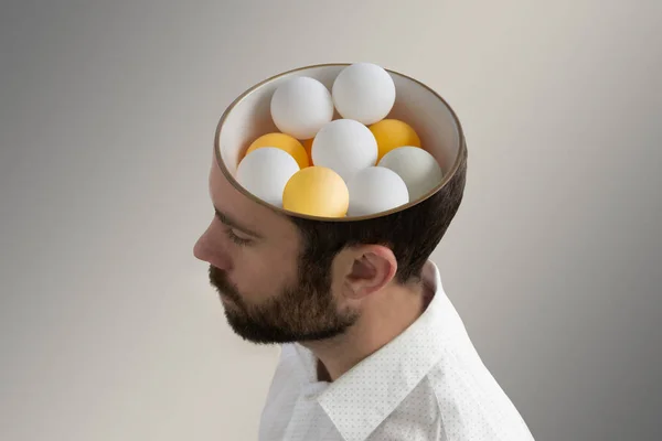 Tischtennisbälle im Kopf eines Mannes. — Stockfoto