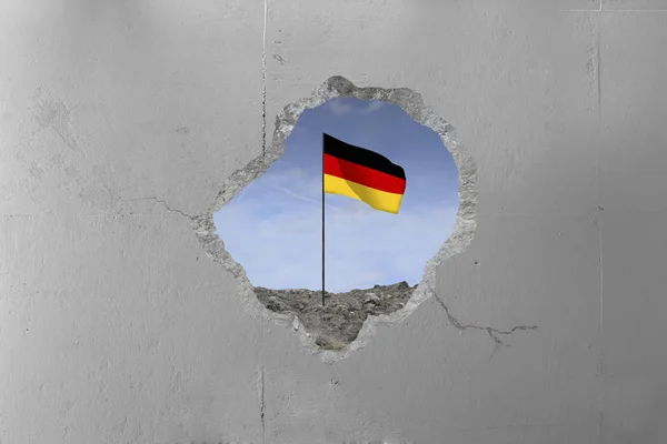 Bandera alemana detrás de un muro de hormigón . —  Fotos de Stock