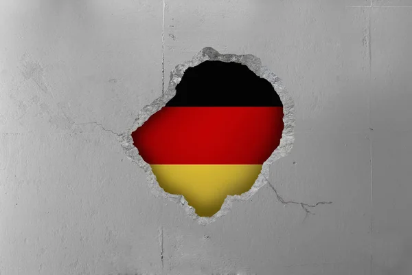 German flag behind a concrete wall. — Stock Photo, Image