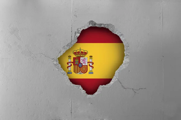 Bandiera spagnola dietro un muro di cemento . — Foto Stock